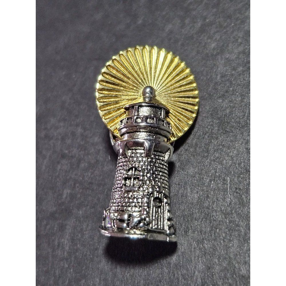 Vintage Avon silver tone and gold tone lighthouse pin